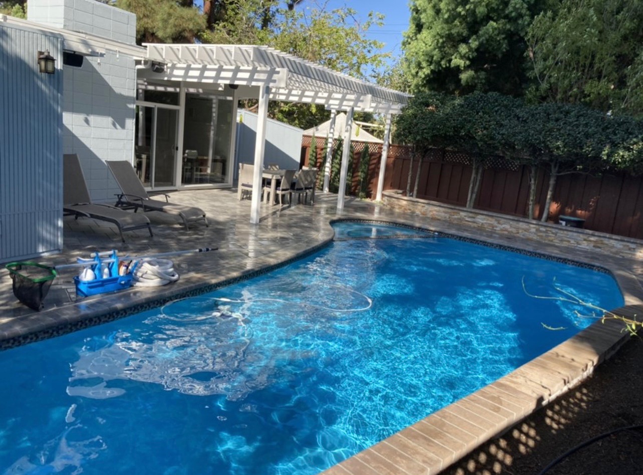 Pool cleaning equipment neatly arranged