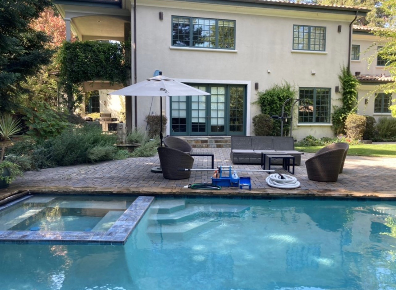 Relaxing poolside view with lounge chairs